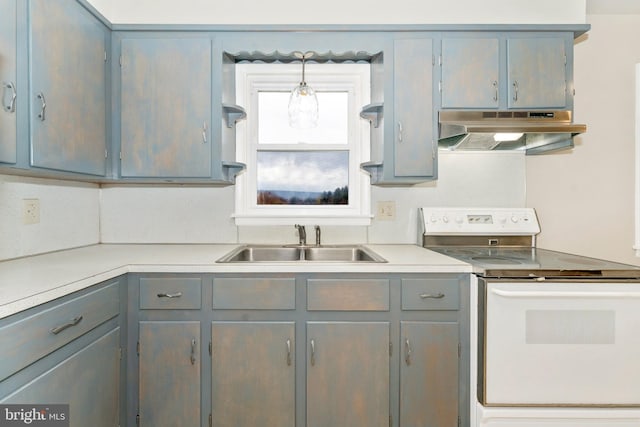 kitchen featuring gray cabinetry, sink, white electric stove, and hanging light fixtures