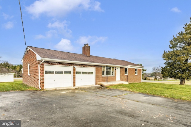 ranch-style home featuring a garage and a front lawn