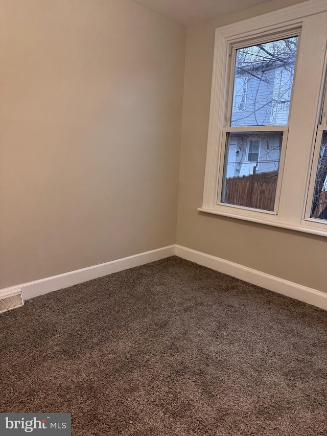 empty room featuring carpet flooring