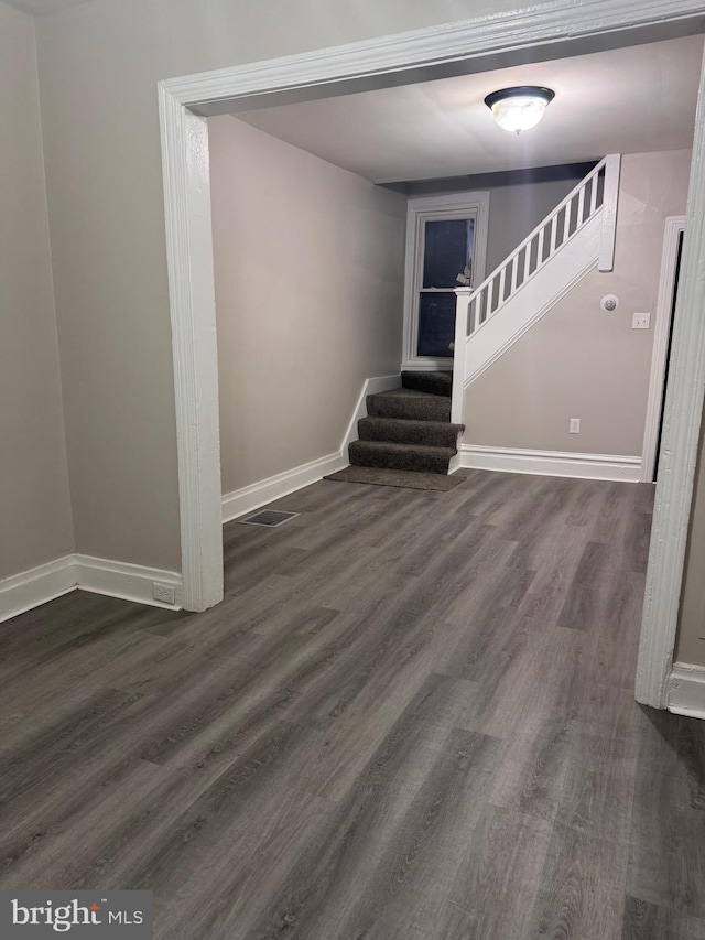 staircase featuring hardwood / wood-style flooring