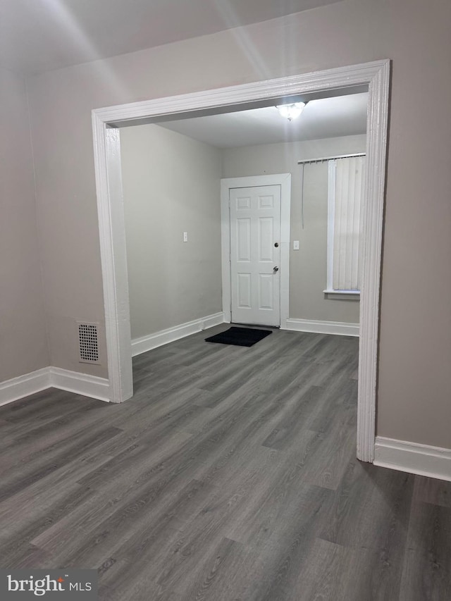 foyer with dark wood-type flooring