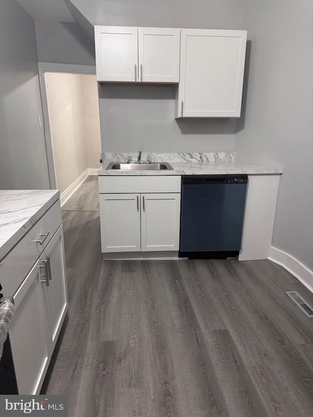 kitchen featuring sink, white cabinets, stainless steel dishwasher, and dark hardwood / wood-style floors