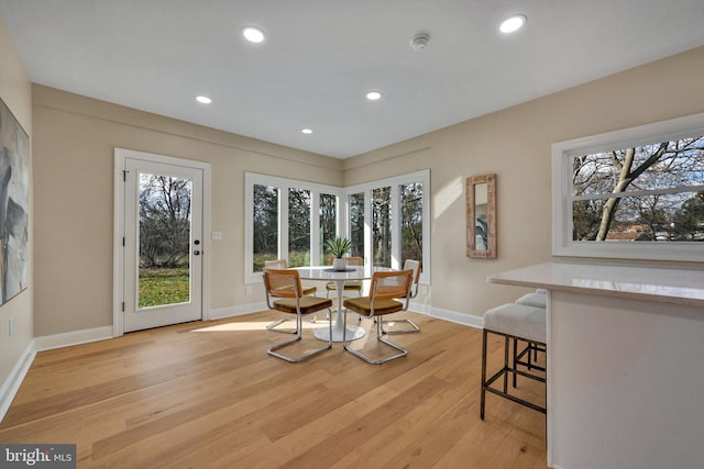 dining area featuring light wood-type flooring