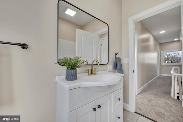 bathroom featuring tile patterned flooring and vanity