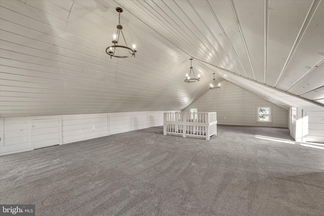 additional living space with carpet, lofted ceiling, and wood ceiling