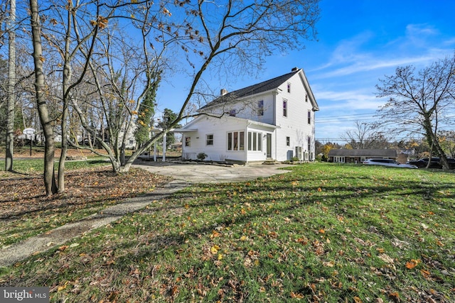 exterior space with a yard and a patio area