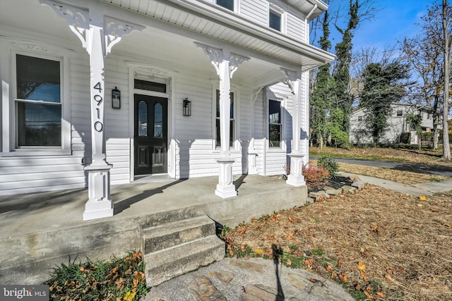 entrance to property featuring covered porch