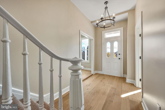 entrance foyer featuring a chandelier and light hardwood / wood-style floors