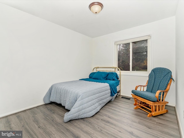 bedroom featuring hardwood / wood-style floors