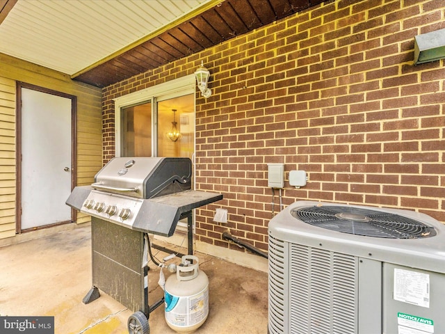 view of patio / terrace featuring area for grilling and cooling unit