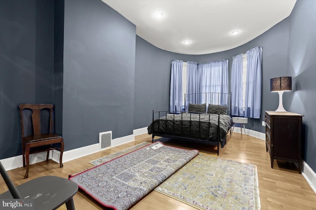 bedroom with light hardwood / wood-style floors