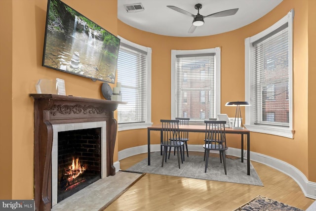 office area with ceiling fan and wood-type flooring