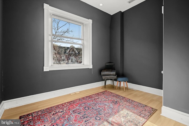 sitting room with light hardwood / wood-style floors