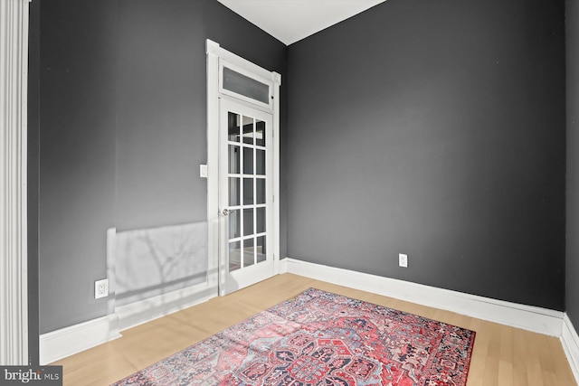 empty room featuring wood-type flooring