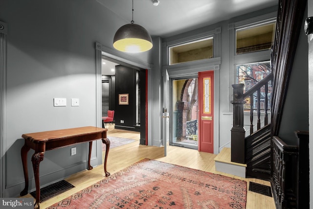 foyer with light hardwood / wood-style flooring