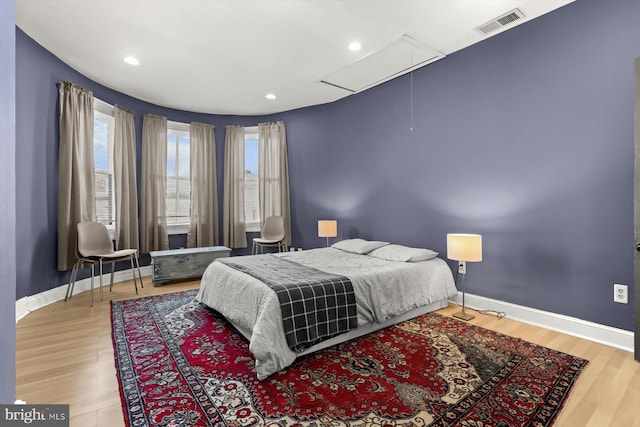 bedroom with wood-type flooring