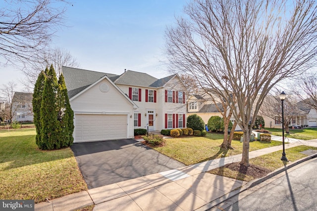 1721 Dearbought Dr, Frederick, MD 21701 - colonial inspired home with driveway, a front yard, and a garage