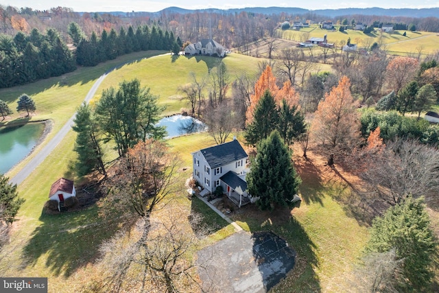 aerial view with a rural view and a water and mountain view