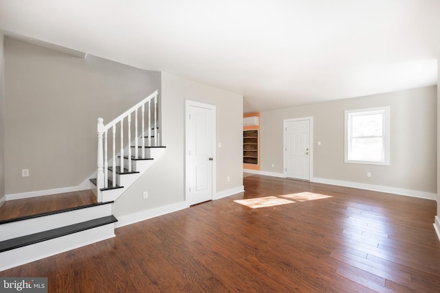 unfurnished living room featuring hardwood / wood-style floors