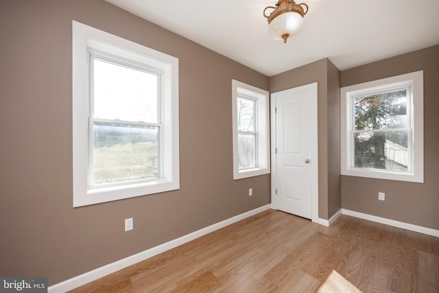 unfurnished bedroom featuring light wood-type flooring