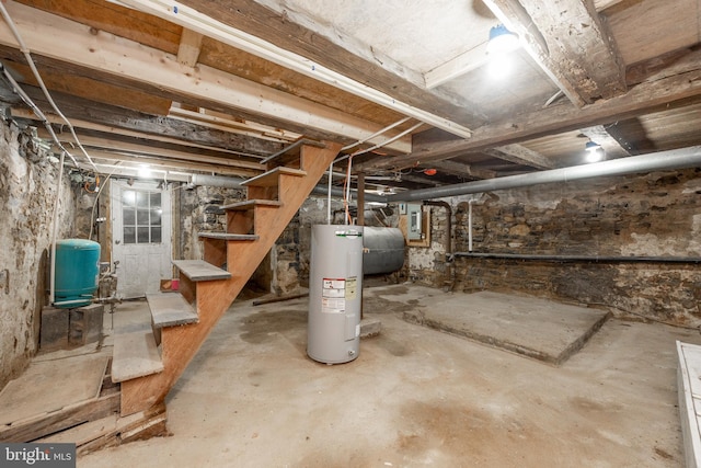 basement with electric water heater and electric panel