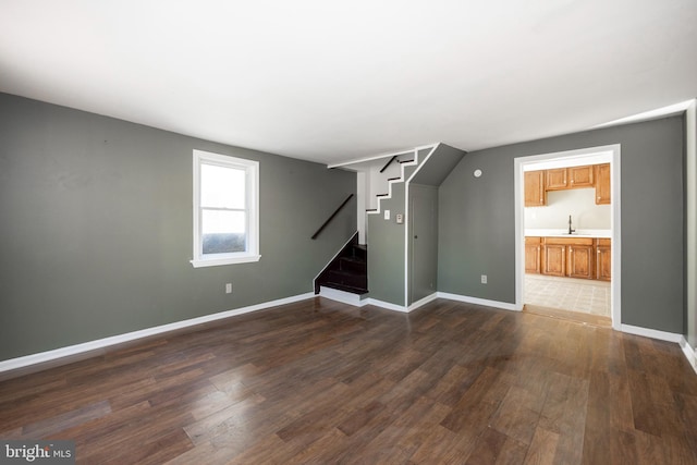 interior space with dark hardwood / wood-style floors and sink