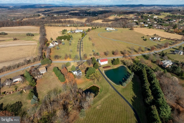 aerial view with a rural view and a water view