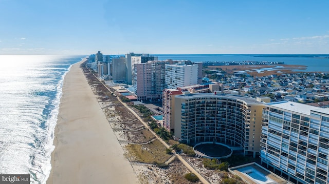 bird's eye view featuring a water view and a view of the beach