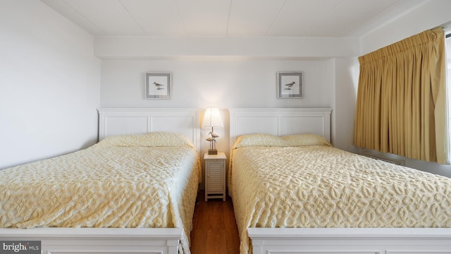 bedroom with hardwood / wood-style floors