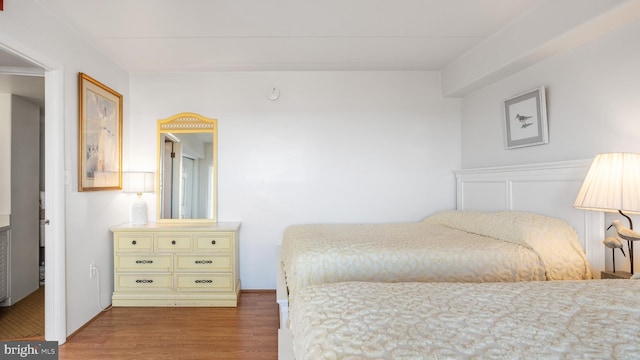 bedroom with wood-type flooring