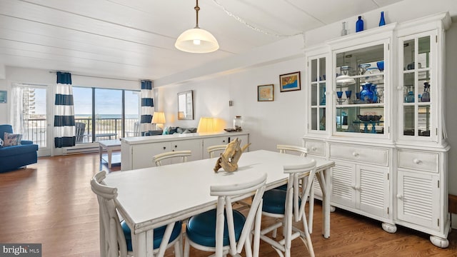 dining space with dark wood-type flooring