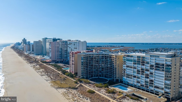 bird's eye view with a view of the beach and a water view