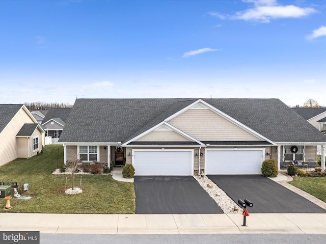 view of front of home featuring a front lawn and a garage