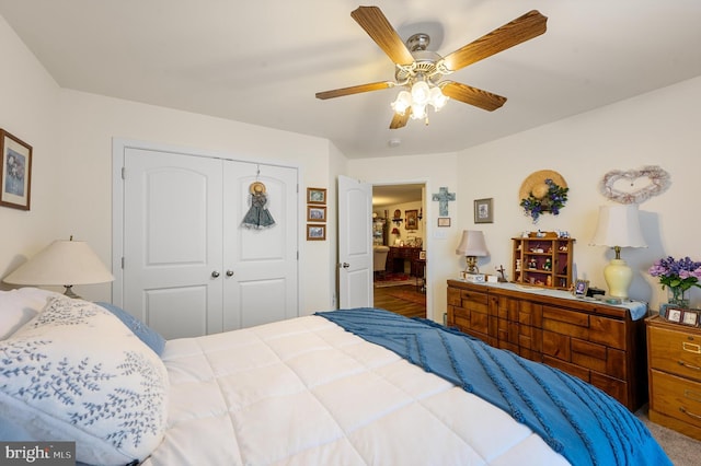 bedroom featuring ceiling fan and a closet