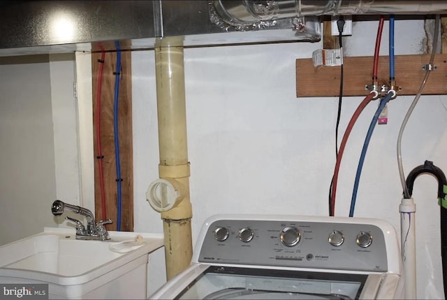 laundry area with sink and washer / clothes dryer