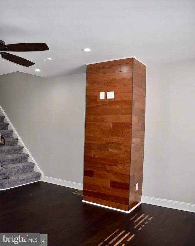 empty room featuring dark hardwood / wood-style floors and ceiling fan