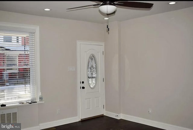 entrance foyer with ceiling fan and dark hardwood / wood-style flooring