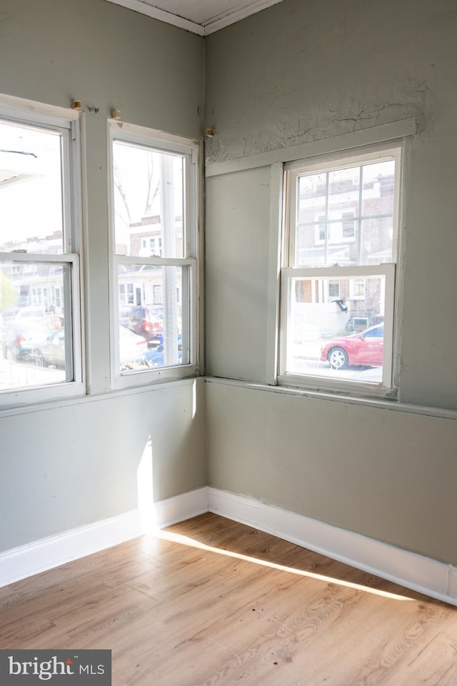 spare room with light wood-type flooring