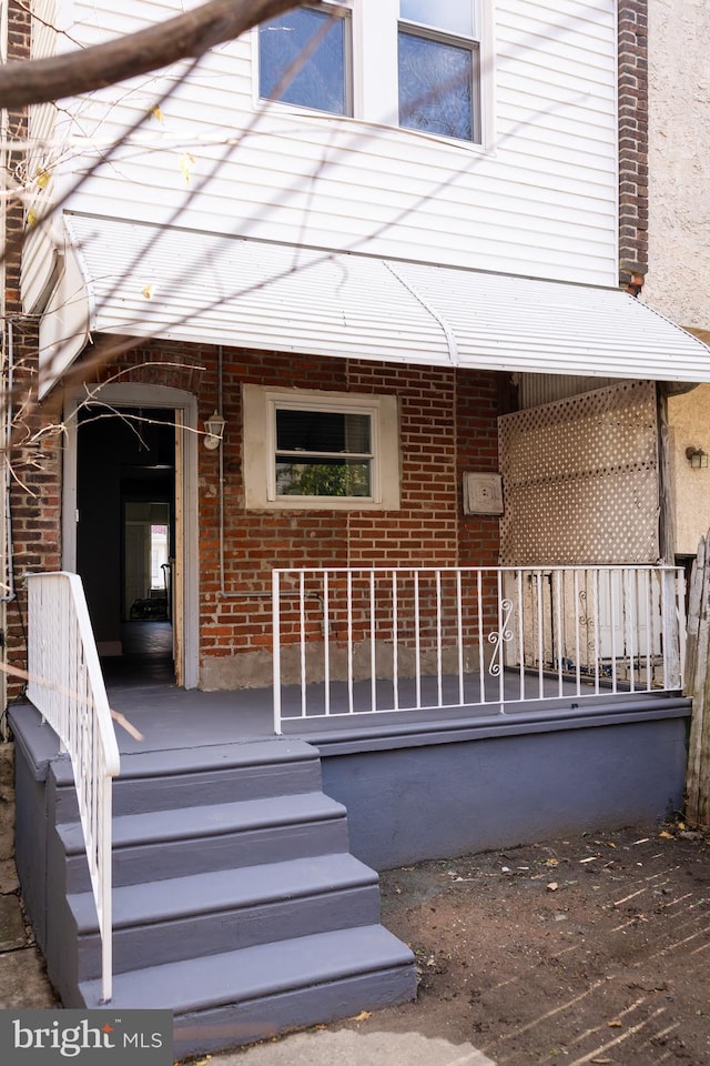 entrance to property with a porch