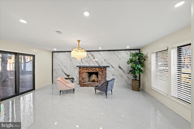 sitting room with a healthy amount of sunlight, tile walls, and a brick fireplace