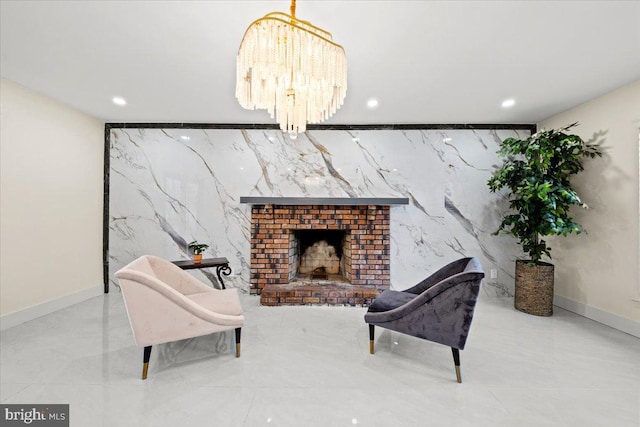 living area featuring a fireplace and an inviting chandelier