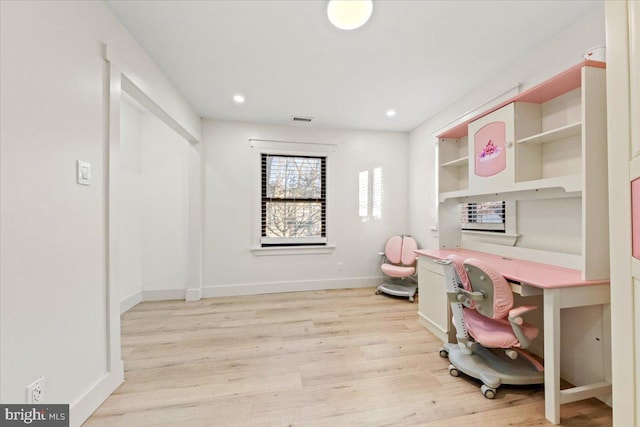 office with light hardwood / wood-style floors