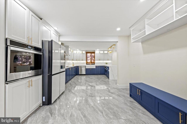 kitchen featuring white cabinetry, blue cabinets, and appliances with stainless steel finishes