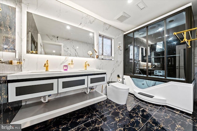 bathroom featuring vanity, toilet, and tile walls