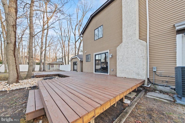 wooden deck with central AC unit