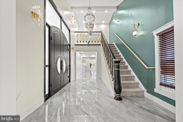 foyer entrance featuring an inviting chandelier