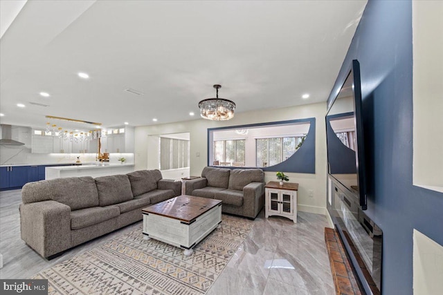 living room with a notable chandelier