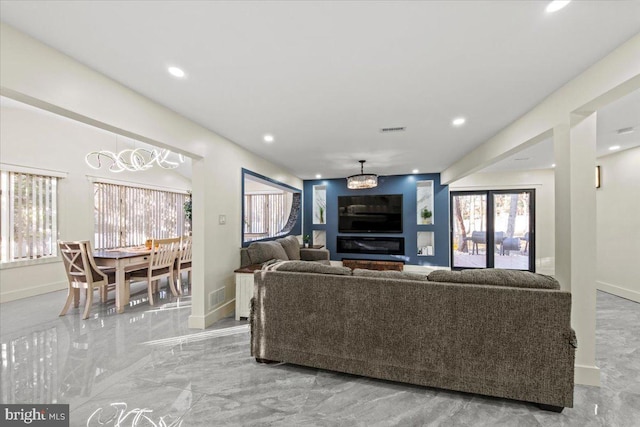 living room featuring a notable chandelier