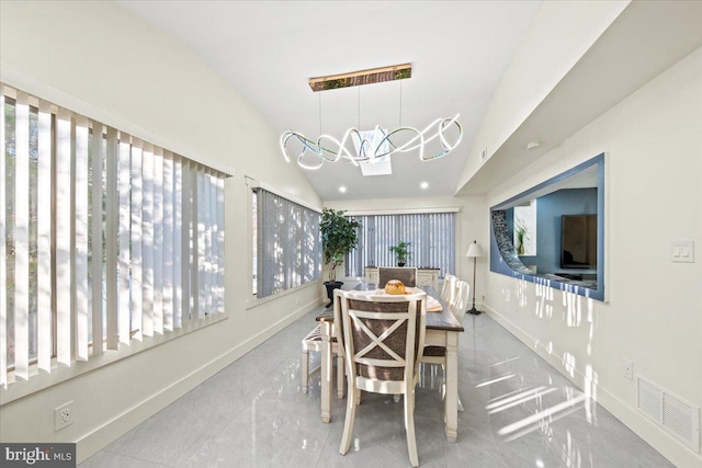 dining room with vaulted ceiling