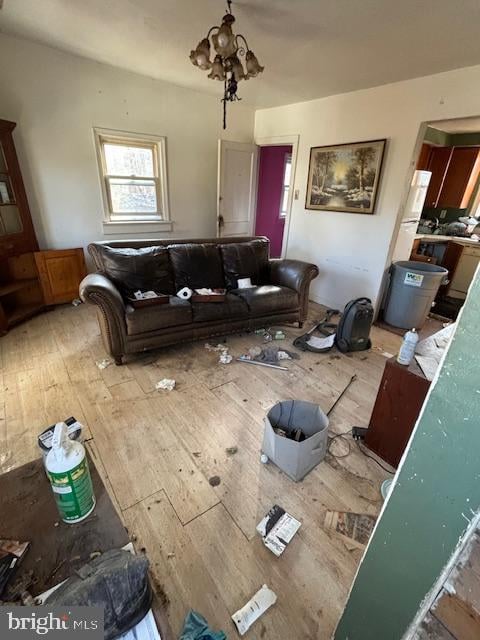 living room featuring hardwood / wood-style floors and a notable chandelier